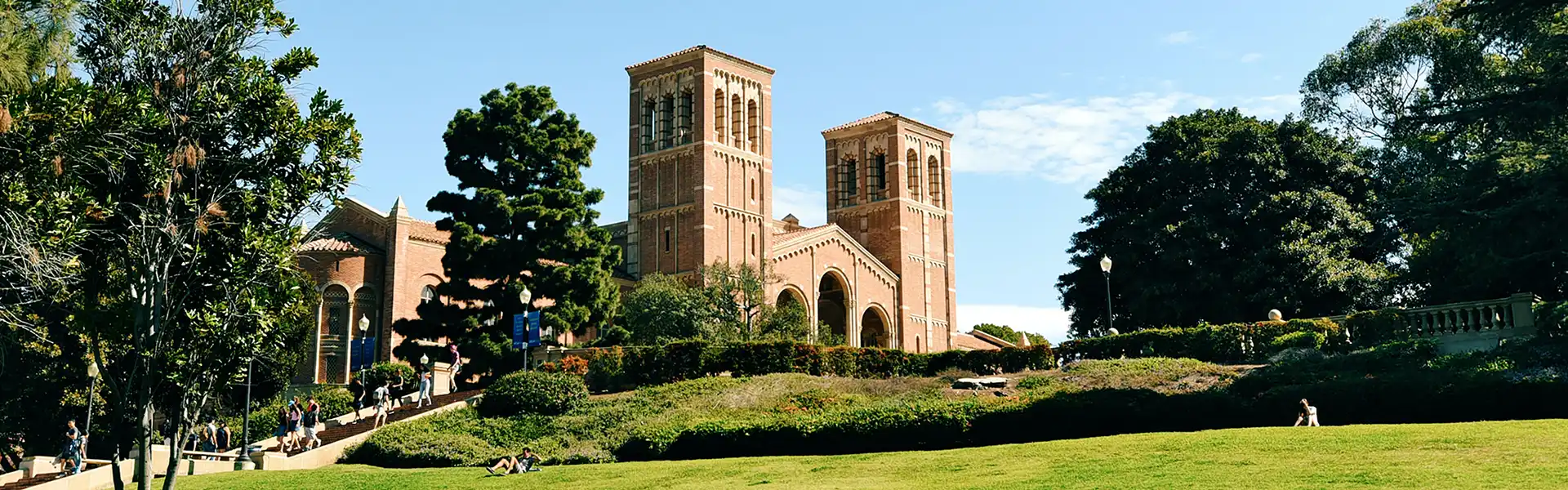 View of Royce Hall, UCLA with a grassy hill in the foreground